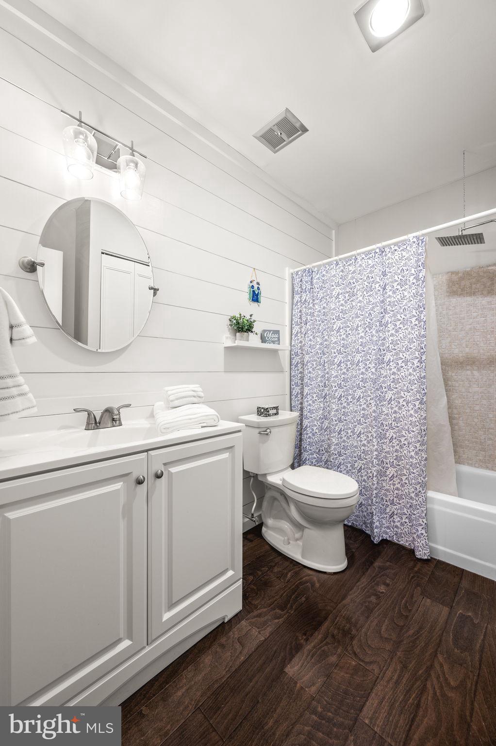 307 Old Forge Crossing Devon, PA 19333 - Photo 19 of 29 a bathroom with a toilet a sink and mirror