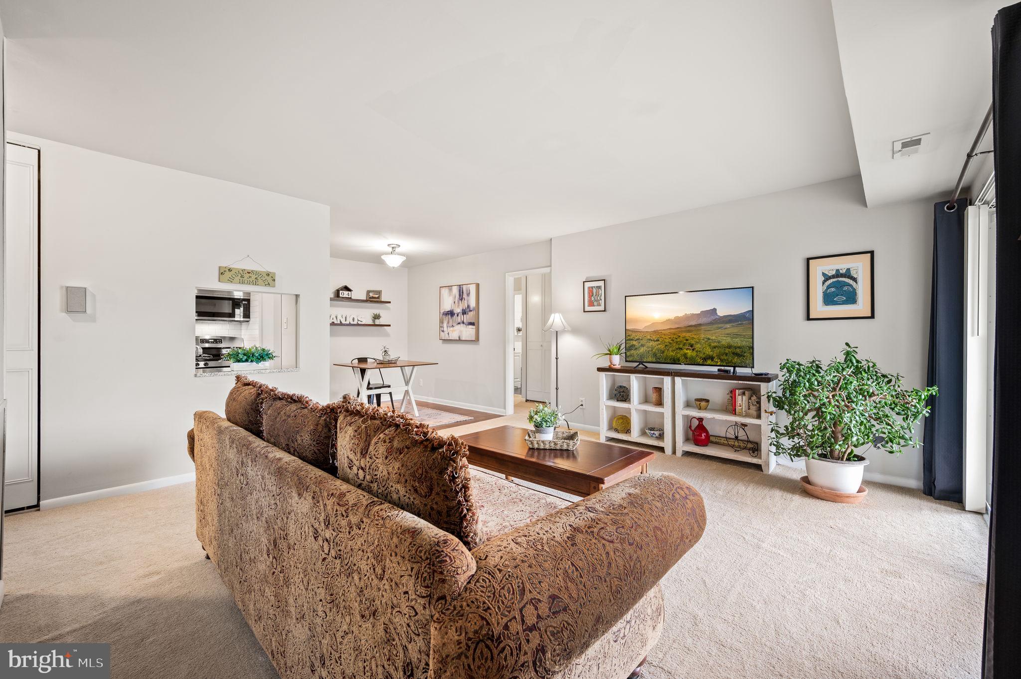 307 Old Forge Crossing Devon, PA 19333 - Photo 2 of 29 a living room with furniture and a flat screen tv