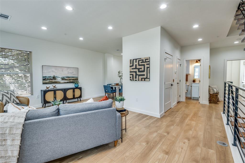 504 South O Connor Road Irving, TX 75060 - Photo 14 of 32 a living room with furniture and wooden floor