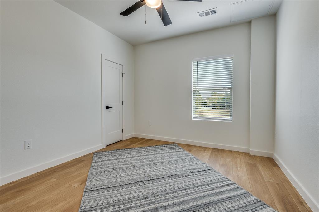 504 South O Connor Road Irving, TX 75060 - Photo 20 of 32 a view of an empty room with window and chandelier fan