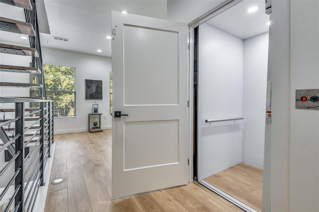 504 South O Connor Road Irving, TX 75060 - Photo 5 of 32 wooden floor in a hall with a glass door