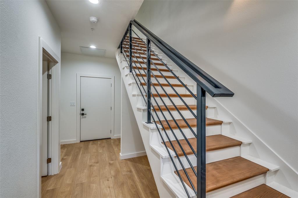 504 South O Connor Road Irving, TX 75060 - Photo 10 of 32 a view of an entryway with wooden floor and stairs