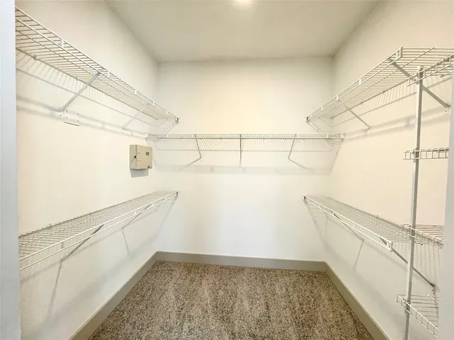 a view of a storage & utility room with empty racks