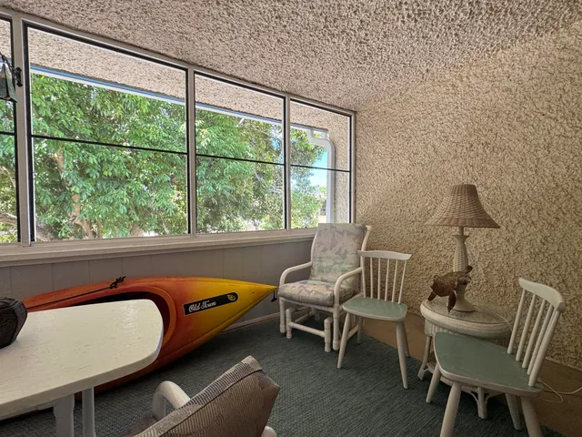 an aerial view of a residential houses with outdoor space