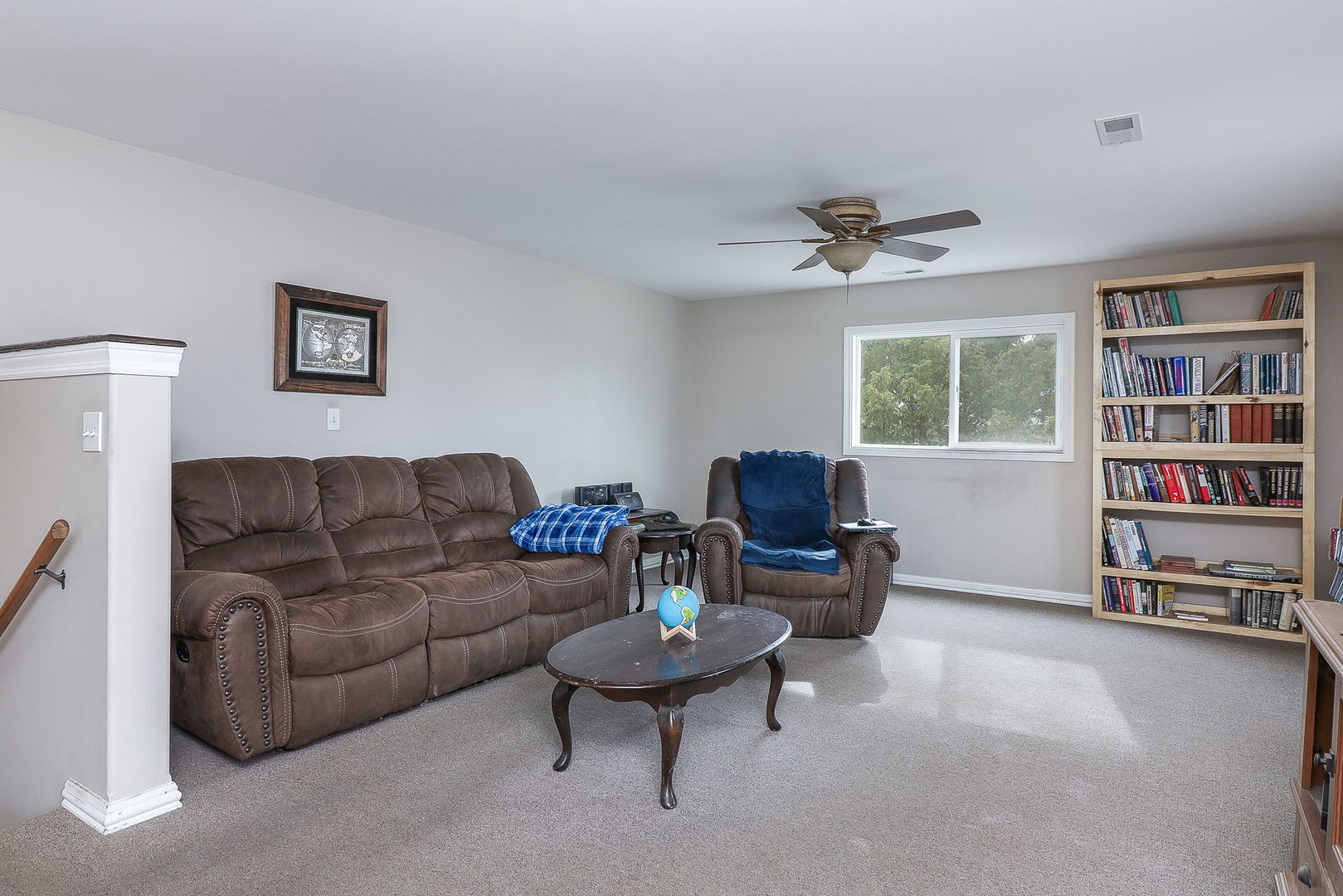 1222 Grove Street Aurora, IL 60505 - Photo 13 of 22 a living room with furniture and a book shelf
