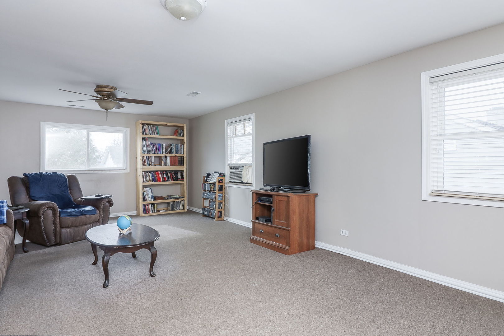 1222 Grove Street Aurora, IL 60505 - Photo 14 of 22 a living room with furniture and a flat screen tv