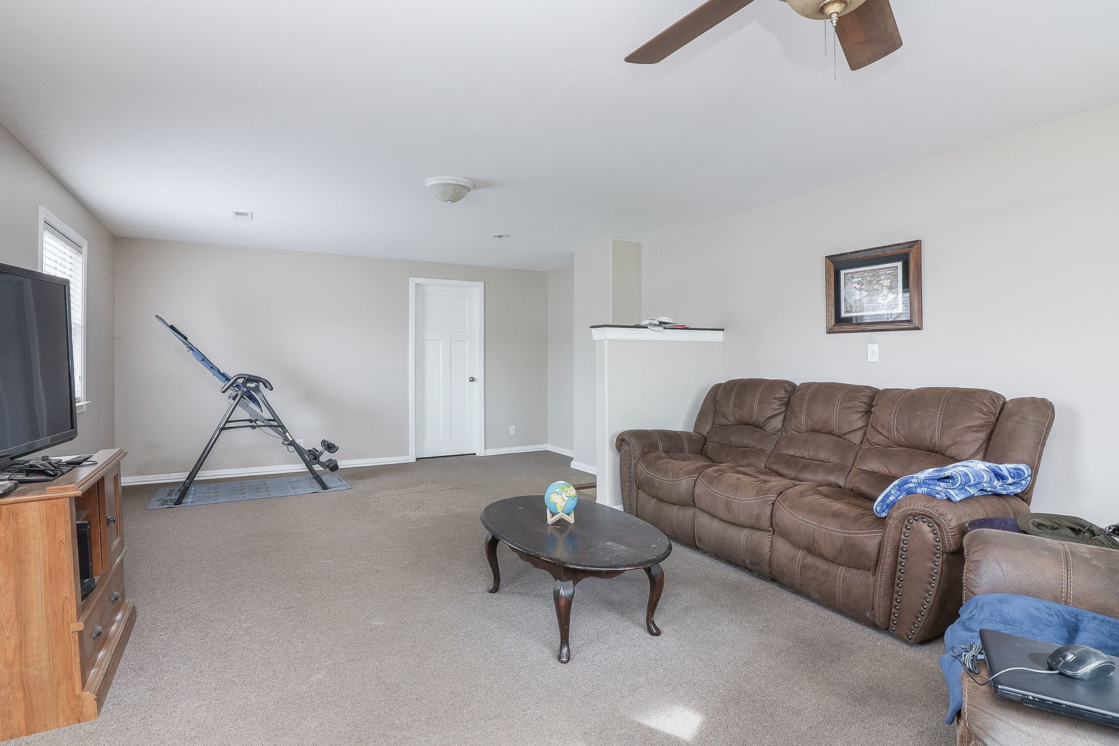 1222 Grove Street Aurora, IL 60505 - Photo 15 of 22 a living room with furniture and a flat screen tv