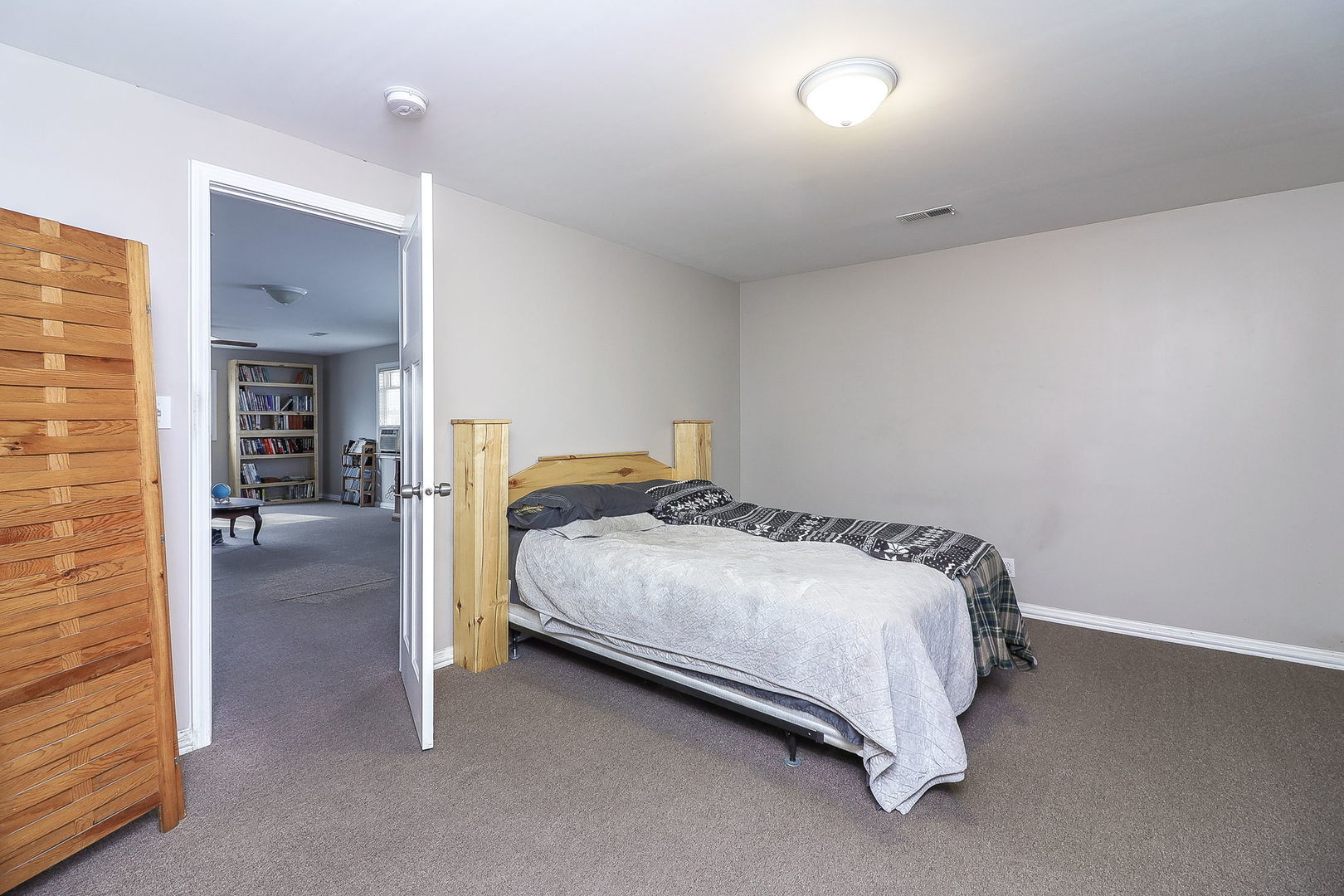 1222 Grove Street Aurora, IL 60505 - Photo 17 of 22 a bedroom with a bed and a view of en suite bathroom