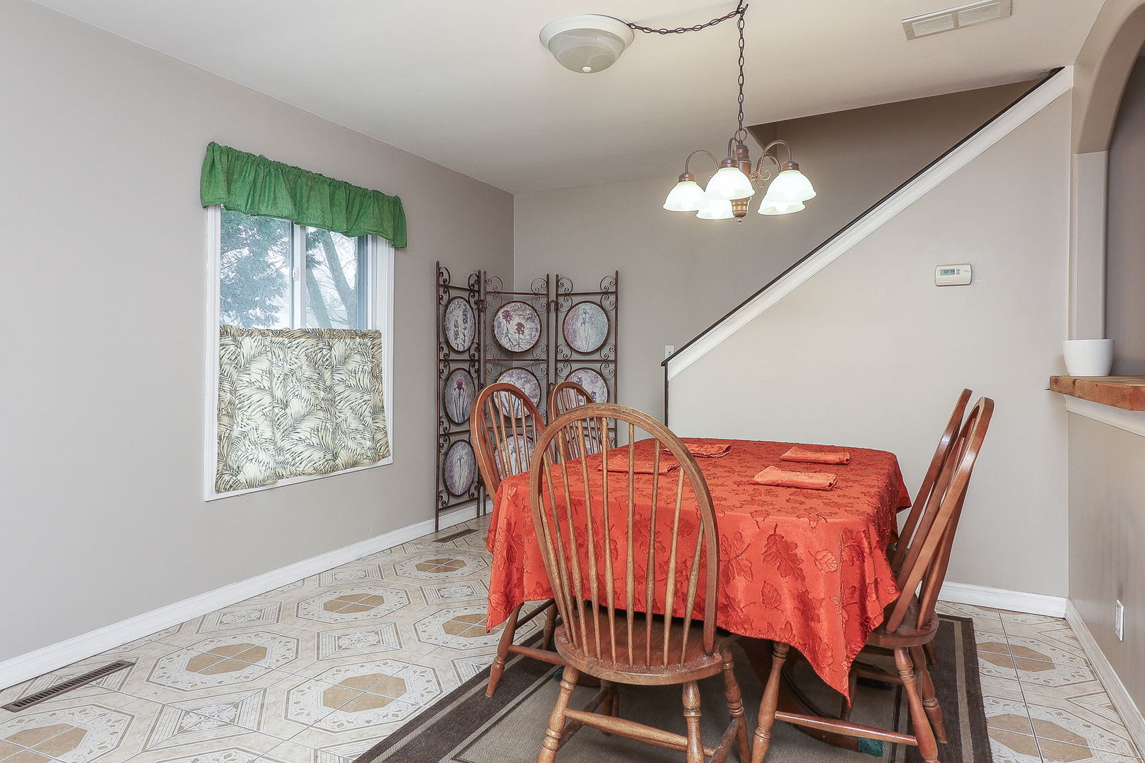 1222 Grove Street Aurora, IL 60505 - Photo 4 of 22 a view of a dining room with furniture window and wooden floor