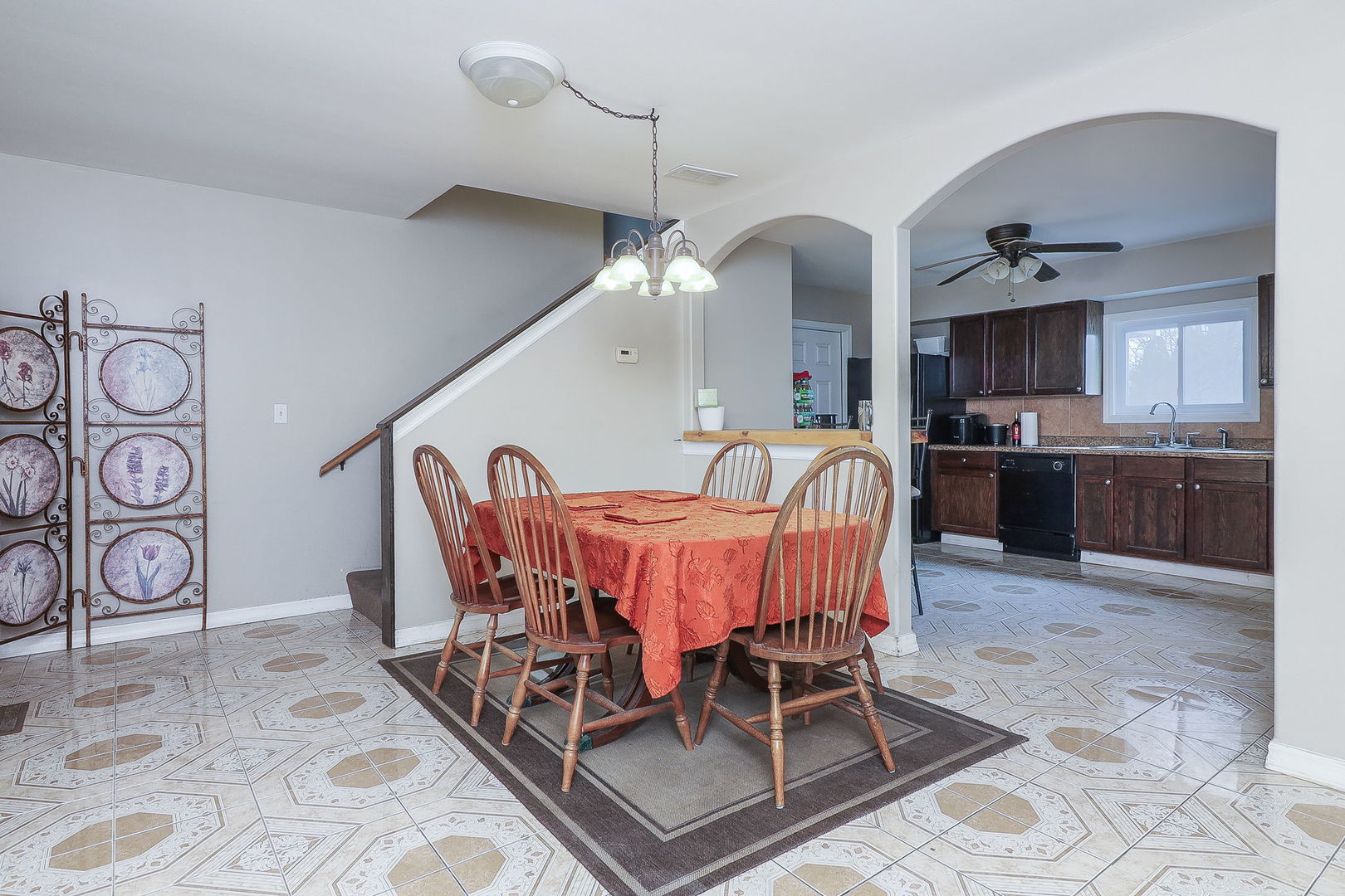 1222 Grove Street Aurora, IL 60505 - Photo 5 of 22 a dining room with furniture and a chandelier