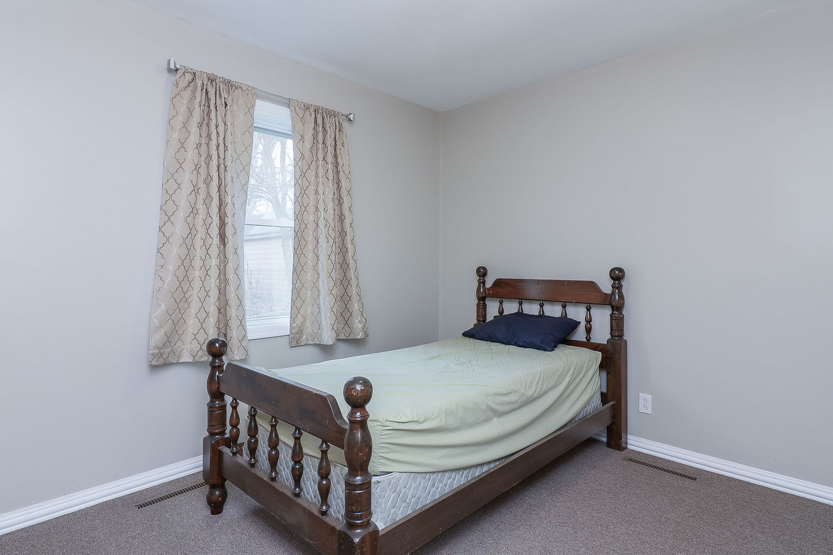 1222 Grove Street Aurora, IL 60505 - Photo 10 of 22 a bedroom with a bed and a window