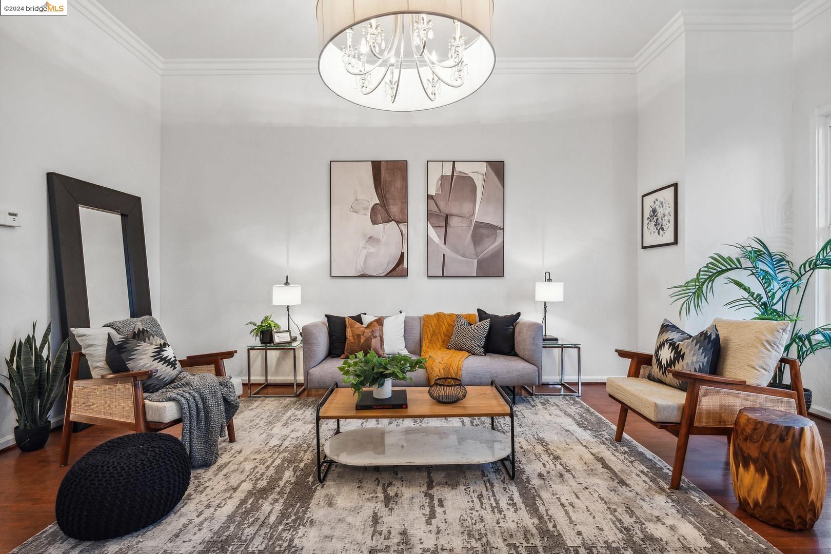 a living room with furniture and a potted plant