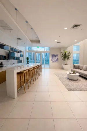 a view of a room with gym equipment and a large window