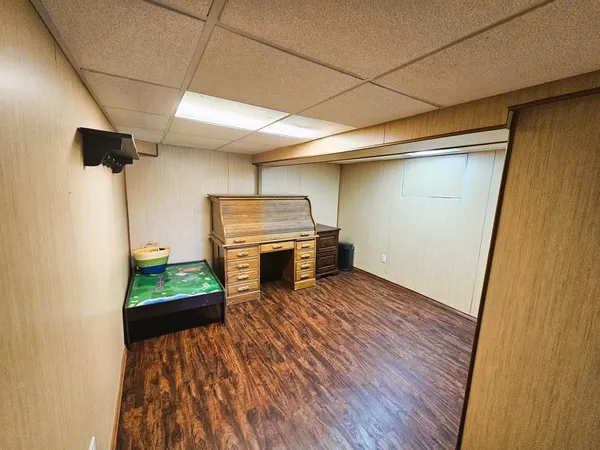 a view of workspace with wooden floor