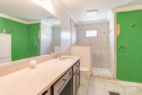 a view of a bathroom with a sink and a mirror