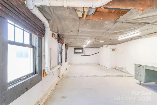 a view of a room with wooden walls