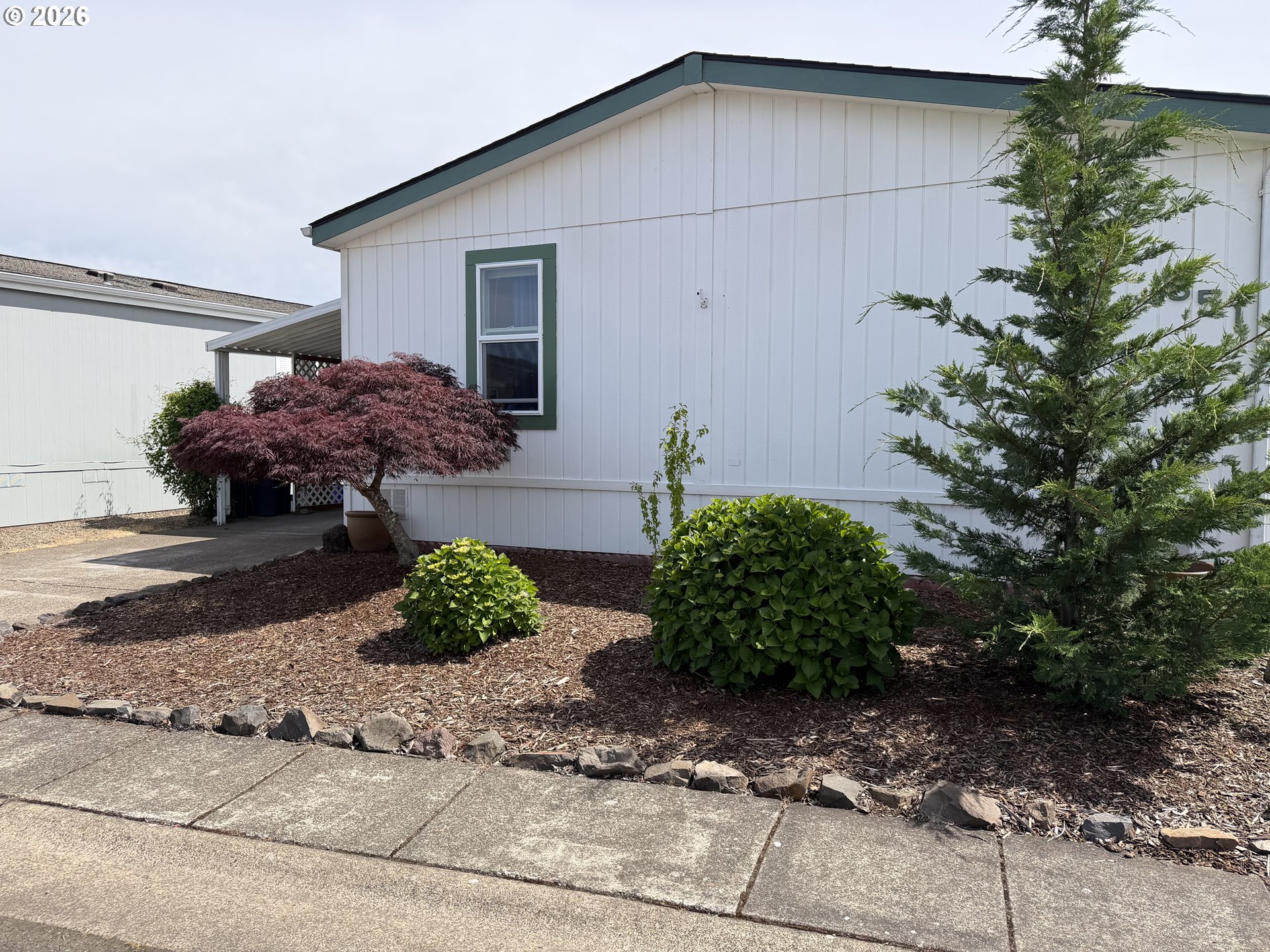 1699 North Terry Street, Unit 351 Eugene, OR 97402 - Photo 17 of 23 a backyard of a house with lots of green space