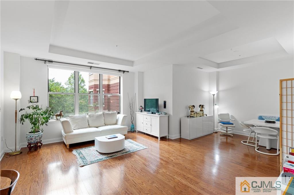 2126 Windrow Drive Plainsboro, NJ 08540 - Photo 1 of 32 a living room with furniture and a large window