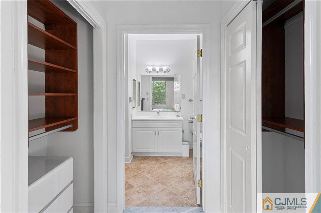 2126 Windrow Drive Plainsboro, NJ 08540 - Photo 13 of 32 a bathroom with a sink and a mirror