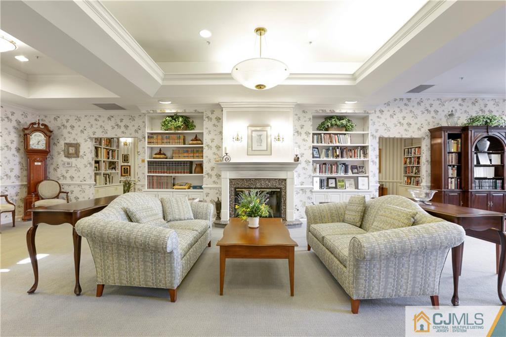 2126 Windrow Drive Plainsboro, NJ 08540 - Photo 20 of 32 a living room with furniture and a fireplace