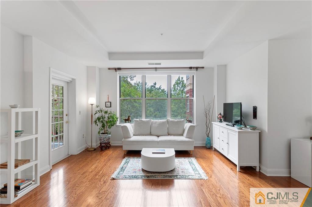2126 Windrow Drive Plainsboro, NJ 08540 - Photo 2 of 32 a living room with furniture and a fireplace
