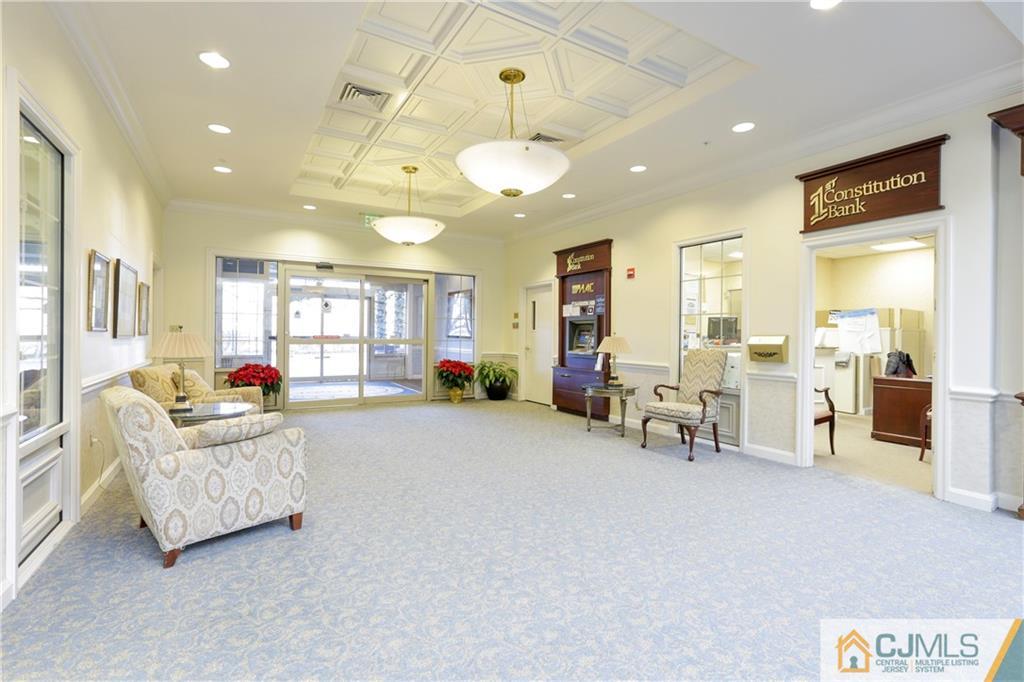 2126 Windrow Drive Plainsboro, NJ 08540 - Photo 21 of 32 a living room with furniture and a chandelier