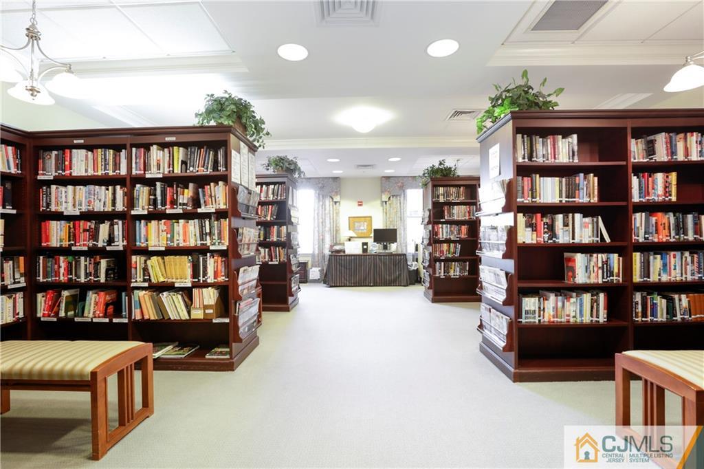 2126 Windrow Drive Plainsboro, NJ 08540 - Photo 25 of 32 a living room with furniture and a book shelf