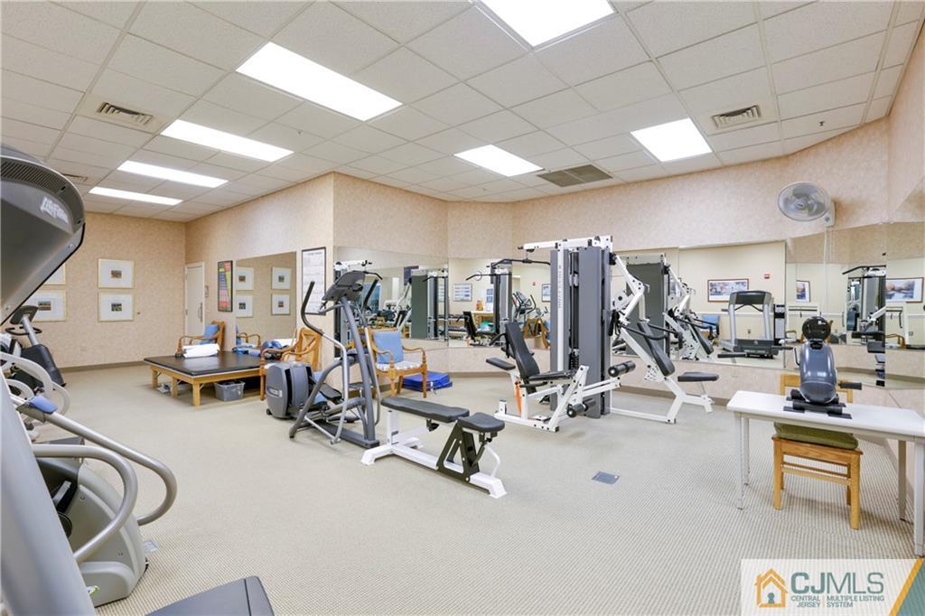 2126 Windrow Drive Plainsboro, NJ 08540 - Photo 27 of 32 a view of a room with gym equipment