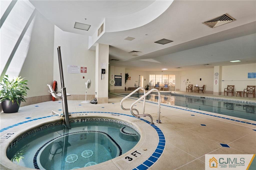 2126 Windrow Drive Plainsboro, NJ 08540 - Photo 30 of 32 a bathroom with a tub sink and mirror