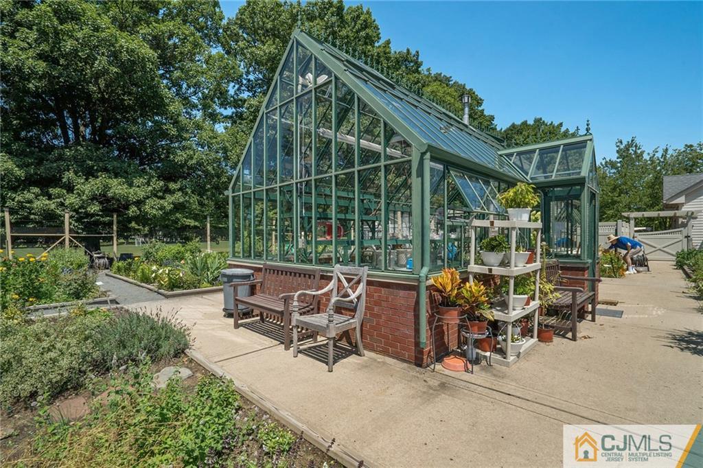 2126 Windrow Drive Plainsboro, NJ 08540 - Photo 31 of 32 a view of a sitting area with furniture and garden