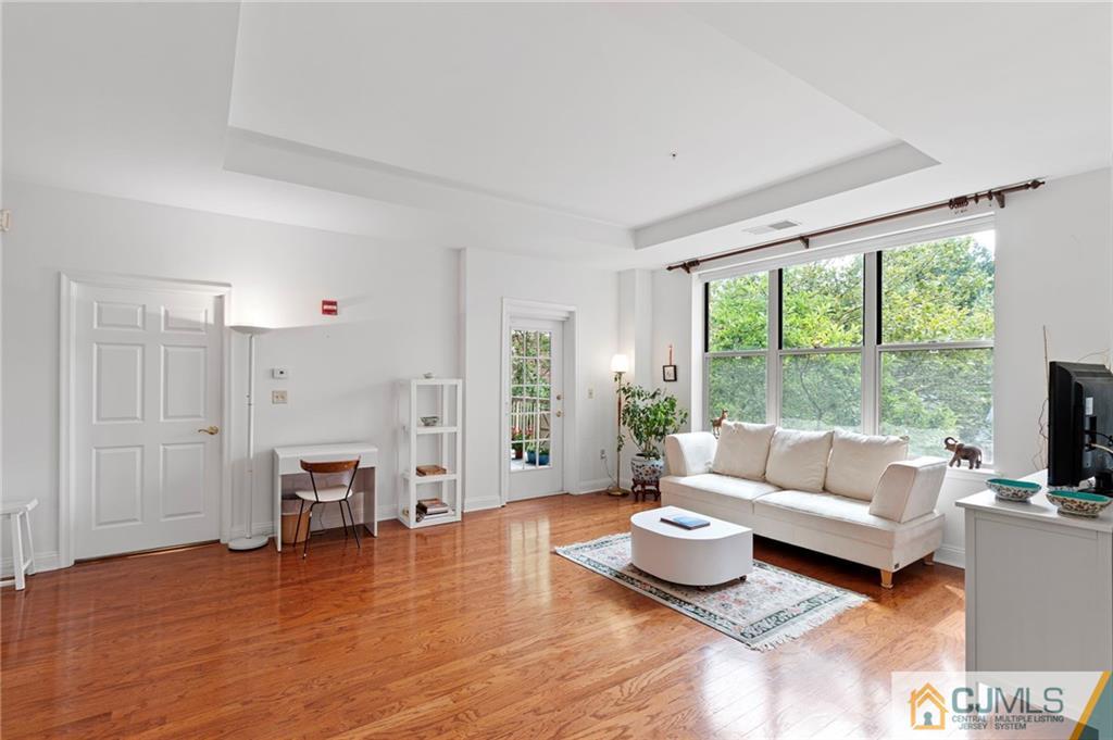 2126 Windrow Drive Plainsboro, NJ 08540 - Photo 4 of 32 a living room with furniture and a large window