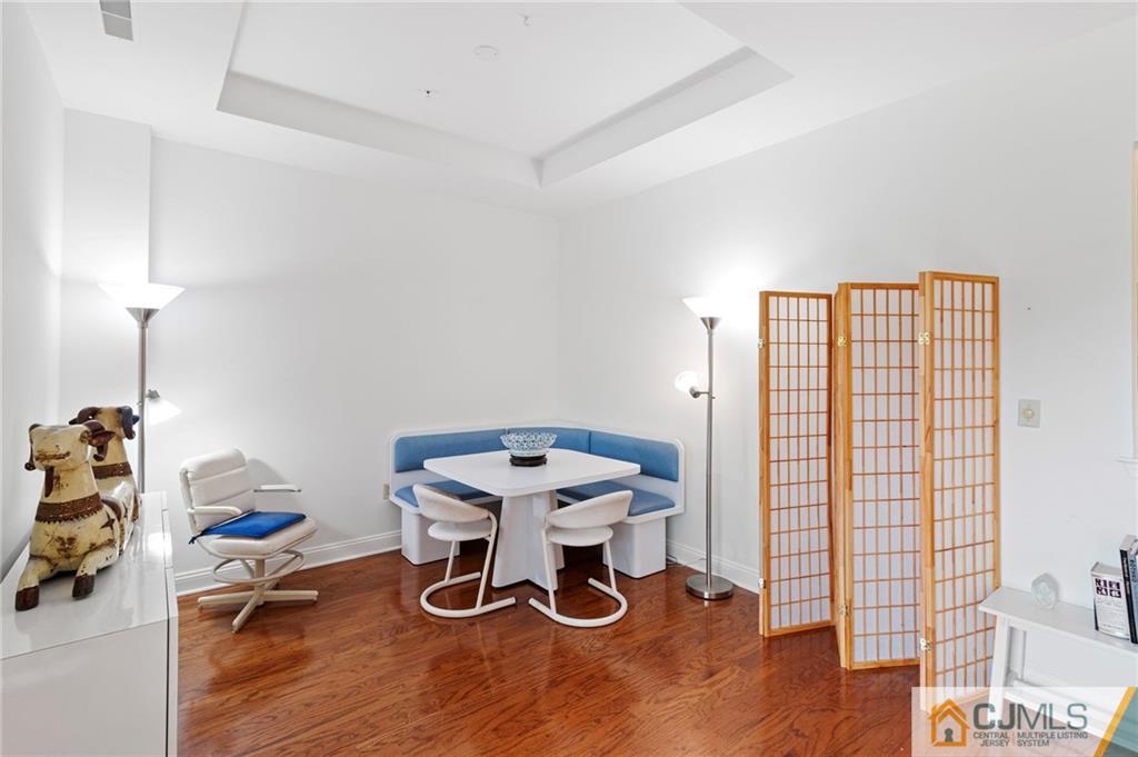 2126 Windrow Drive Plainsboro, NJ 08540 - Photo 5 of 32 a view of a workspace with furniture and wooden floor
