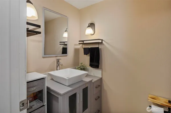 a bathroom with a sink and a mirror