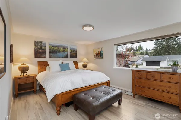 a bedroom with a bed and a dresser