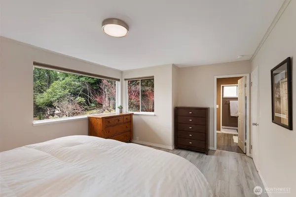 a large bedroom with a large bed and a window