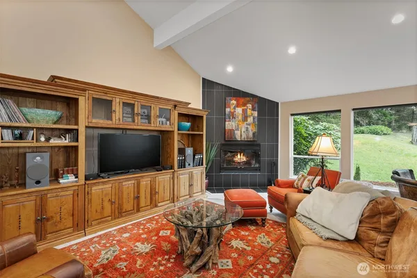a bedroom with furniture and a flat screen tv