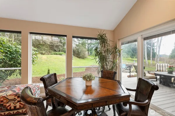 a view of a dining room with furniture window and outside view