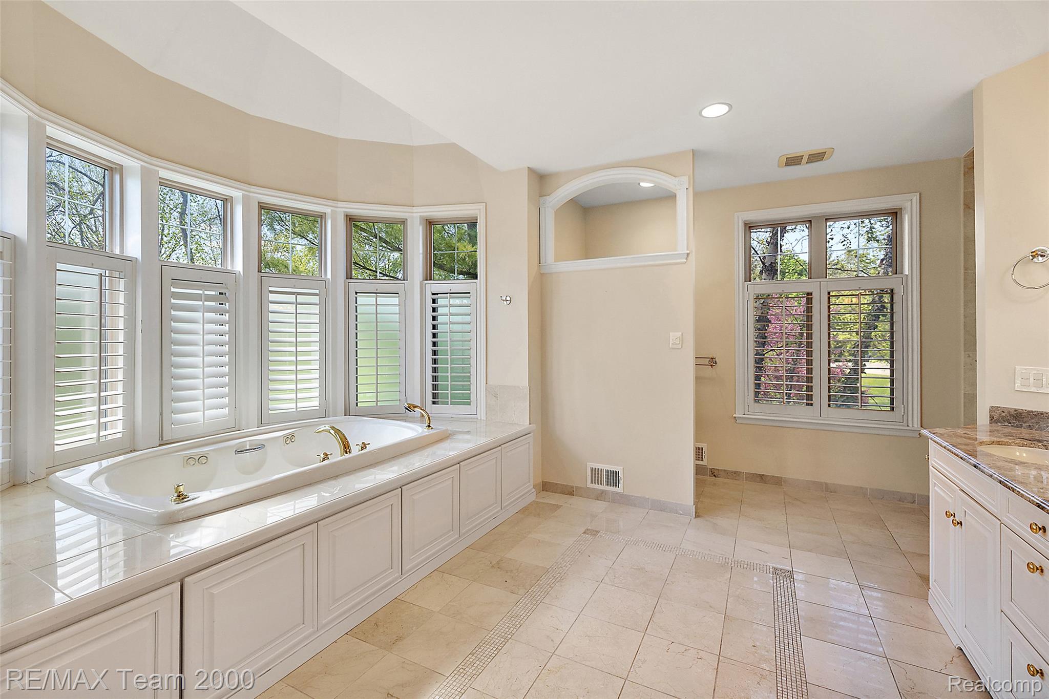 630 Sheldon Court Rochester, MI 48306 - Photo 43 of 94 Full bath with a jetted tub, vanity, recessed lighting, and light tile patterned flooring