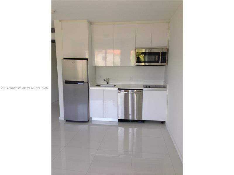 801 15th Street, Unit 109 Miami Beach, FL 33139 - Photo 3 of 9 a view of a kitchen with a sink