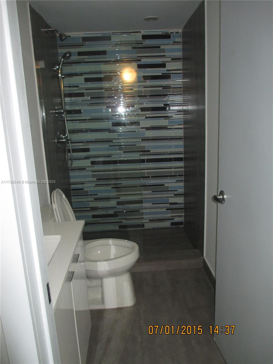 801 15th Street, Unit 109 Miami Beach, FL 33139 - Photo 9 of 9 a bathroom with a toilet and a shower