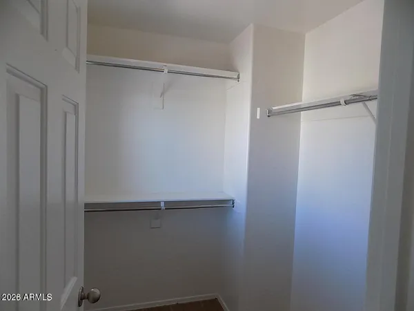 a view of an empty walk in closet