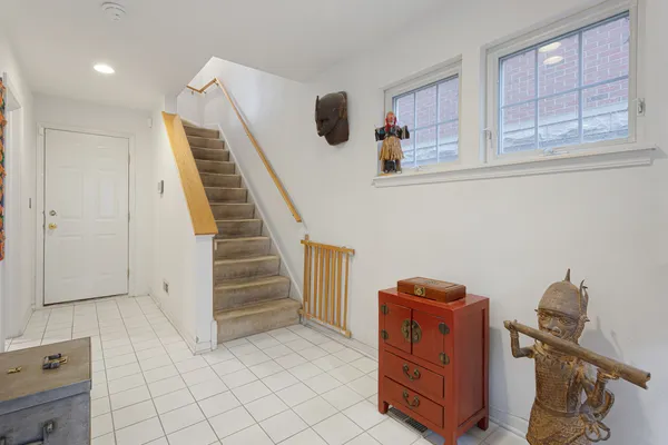 a view of room with stairs and wooden floor