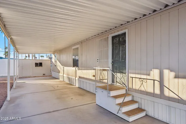 a spacious bathroom with a tub and large window