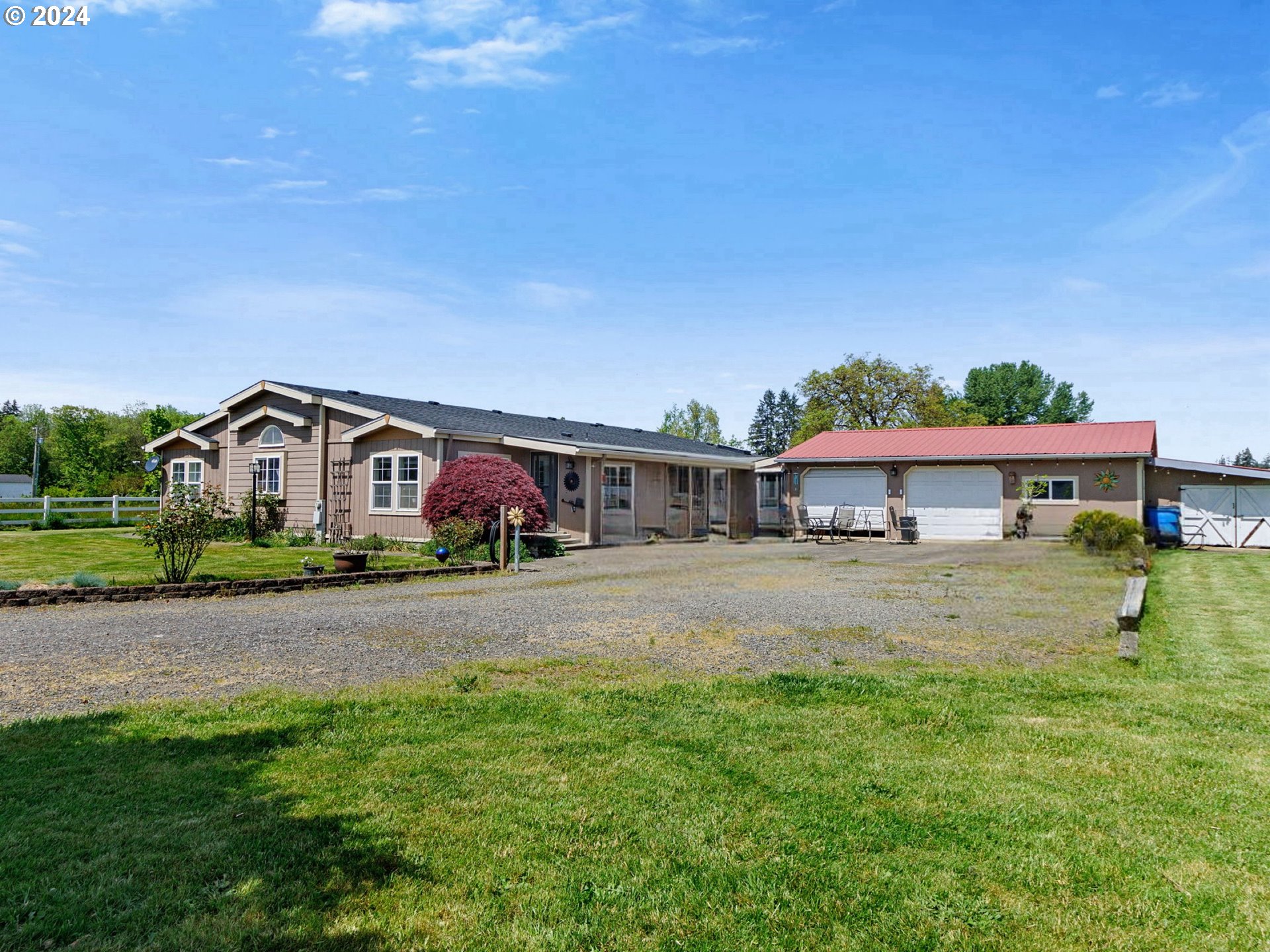 20221 Northeast 22nd Avenue Ridgefield, WA 98642 - Photo 1 of 39 a front view of a house with a garden and deck
