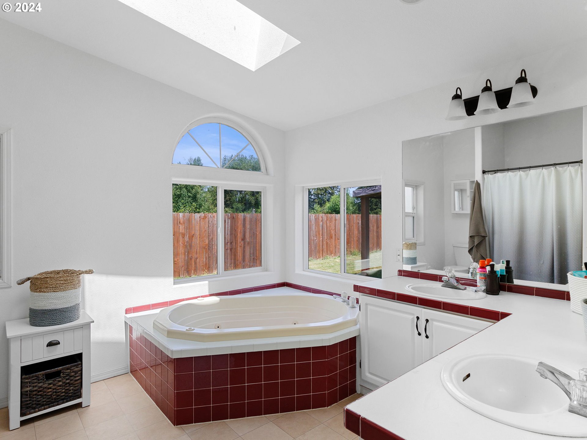 20221 Northeast 22nd Avenue Ridgefield, WA 98642 - Photo 11 of 39 a spacious bathroom with a tub sink and mirror