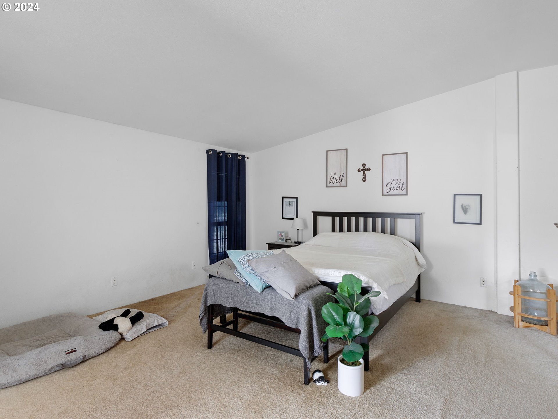 20221 Northeast 22nd Avenue Ridgefield, WA 98642 - Photo 13 of 39 a bedroom with a bed and a table