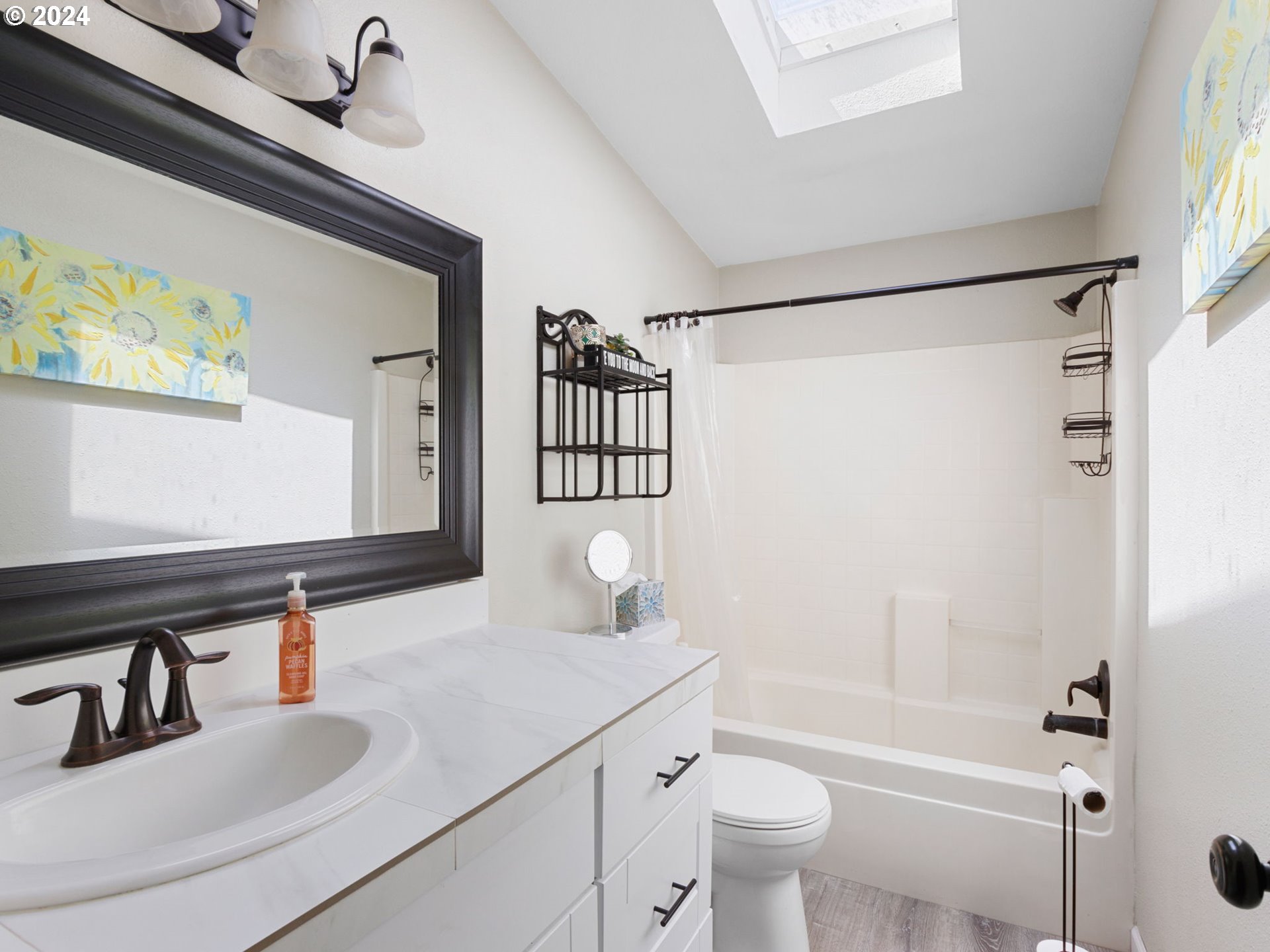 20221 Northeast 22nd Avenue Ridgefield, WA 98642 - Photo 14 of 39 a bathroom with a sink and a mirror