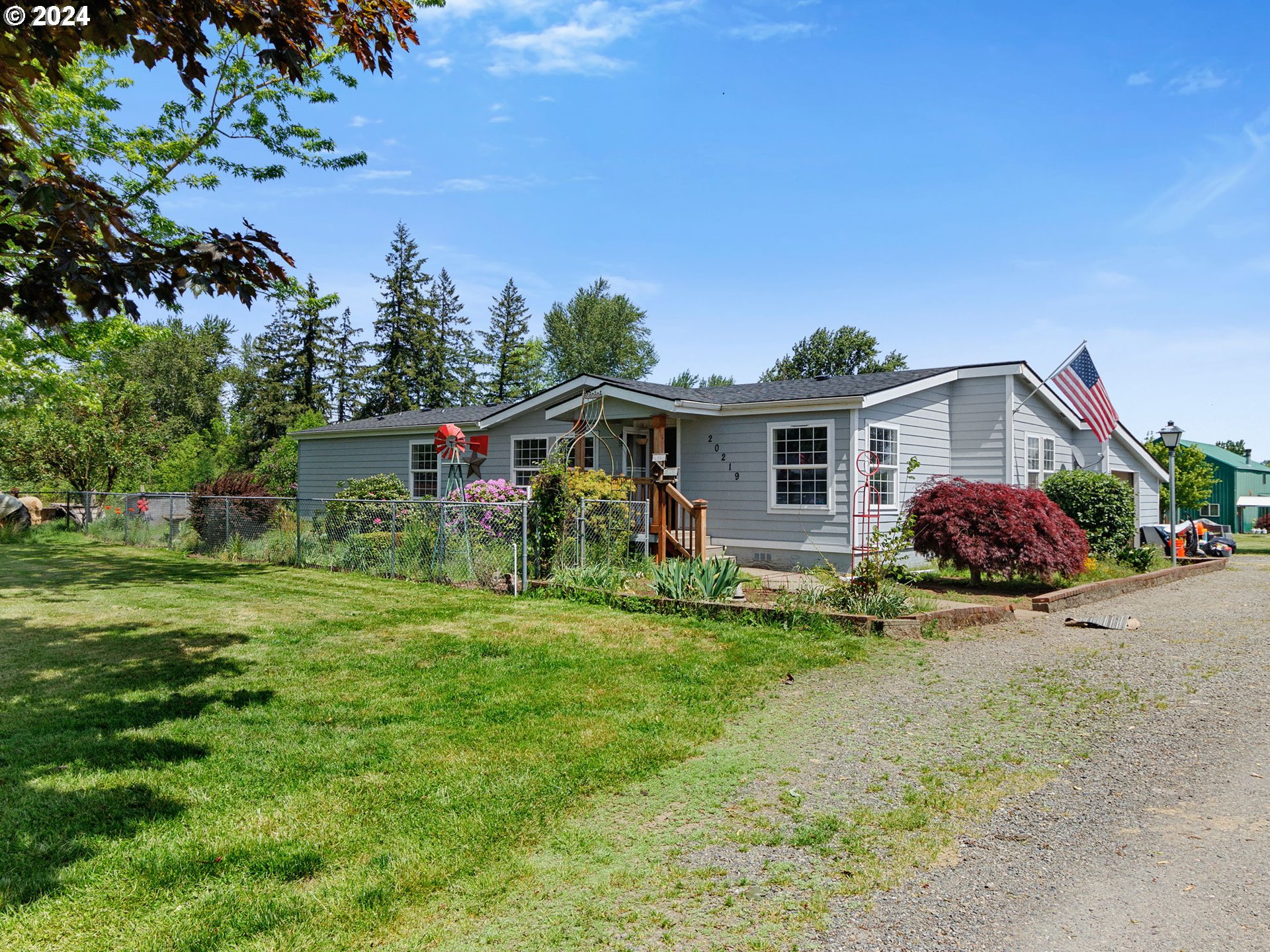 20221 Northeast 22nd Avenue Ridgefield, WA 98642 - Photo 17 of 39 a front view of a house with garden