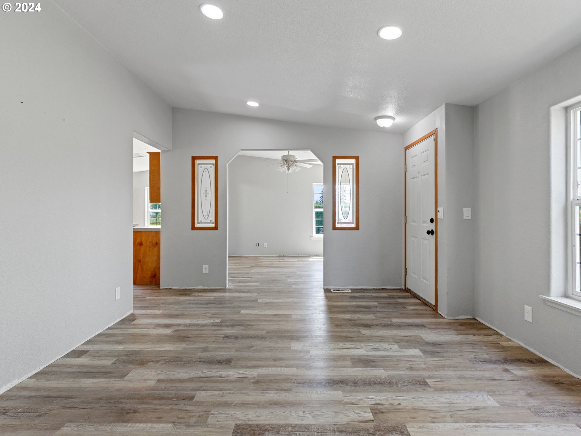 20221 Northeast 22nd Avenue Ridgefield, WA 98642 - Photo 19 of 39 a view of a big room with wooden floor and windows