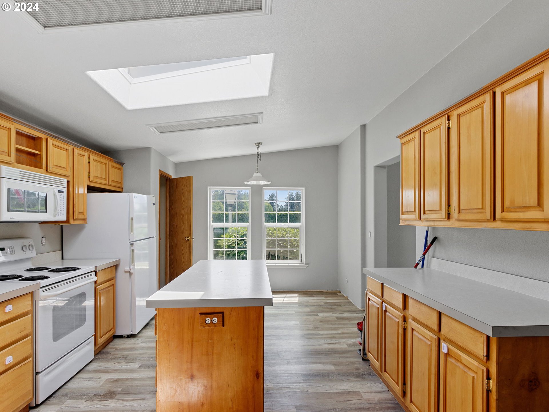 20221 Northeast 22nd Avenue Ridgefield, WA 98642 - Photo 21 of 39 a kitchen with stainless steel appliances granite countertop a refrigerator a stove and a sink with cabinets